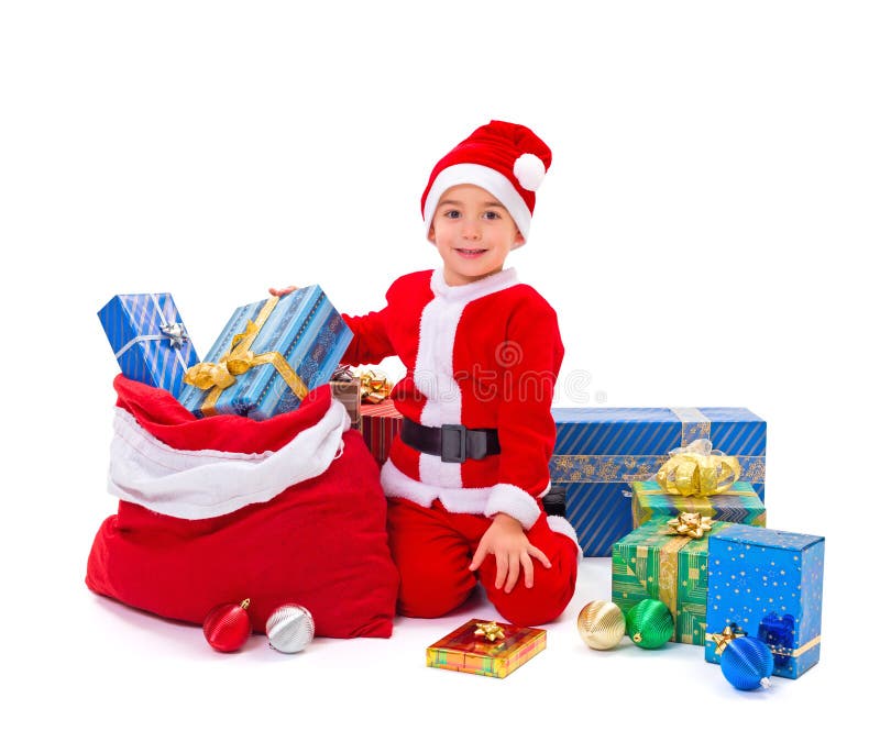 Petit garçon de Santa Claus avec des présents photos stock Petit garçon de Santa Claus avec des présents photos stock