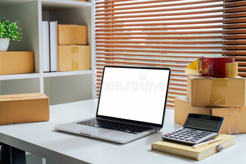 Small Business delivery modern room with laptop white screen at home office. Small Business delivery modern room with laptop white screen at home office.