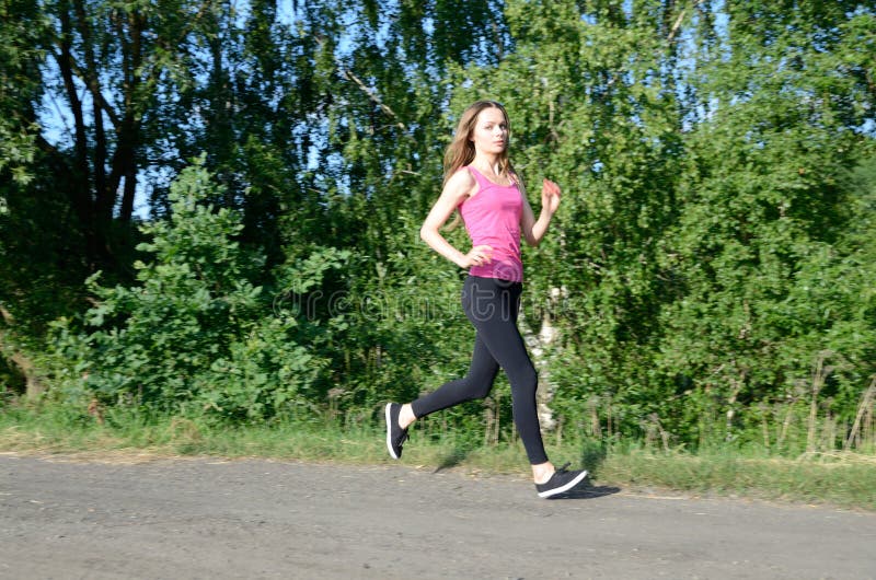 Petite Female Running in the Forest Stock Photo - Image of petite, woman:  120178094