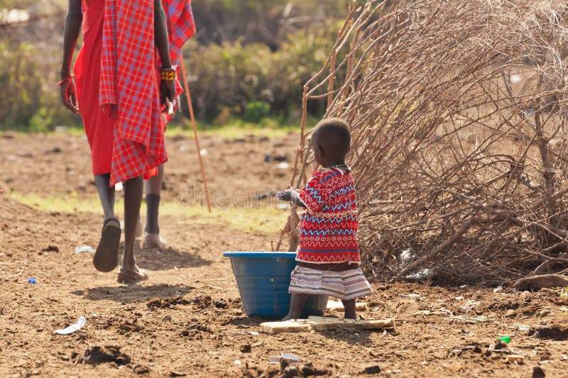 African little girl washes in her village. African little girl washes in her village