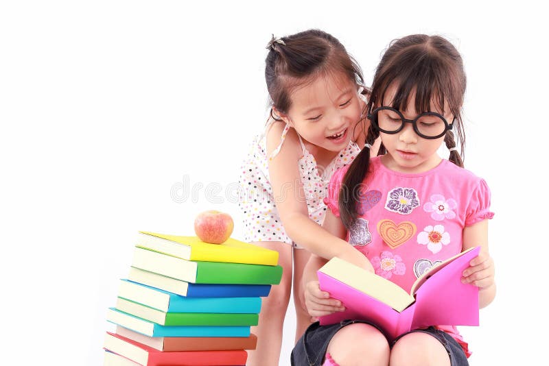 Two student little asian girl reading the book. Two student little asian girl reading the book