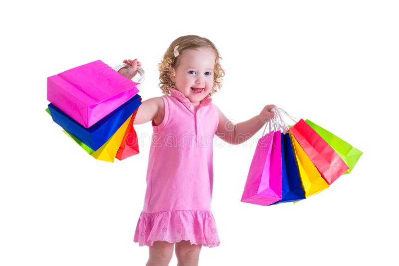 Petite fille avec des sacs à provisions images stock Petite fille avec des sacs à provisions images stock