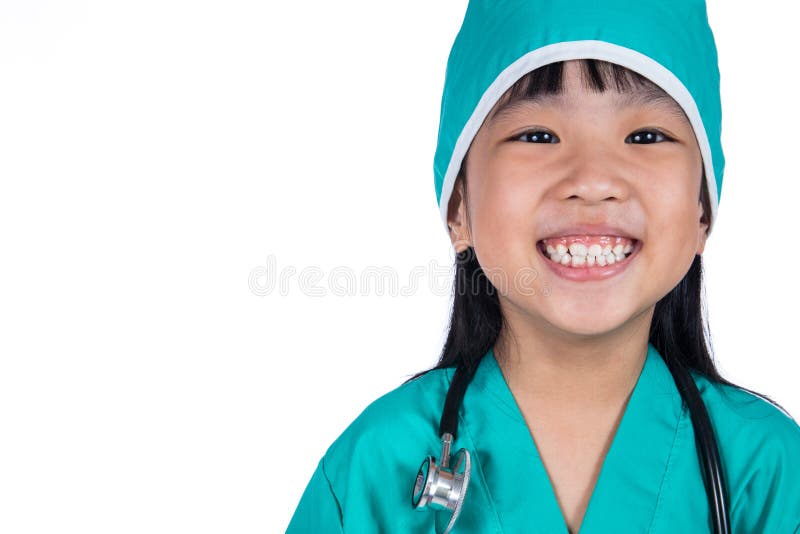 Petite fille chinoise asiatique habillée en tant que docteur photos stock Petite fille chinoise asiatique habillée en tant que docteur photos stock