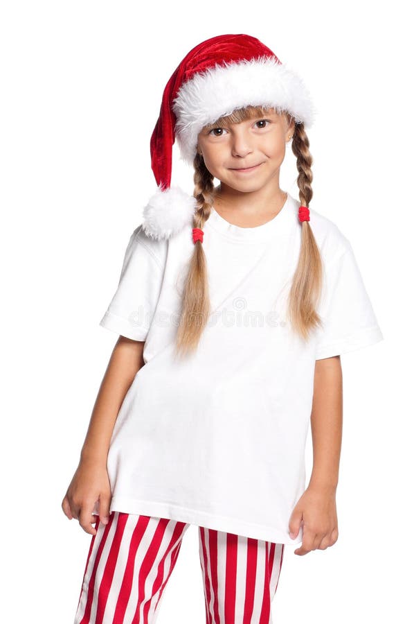 Petite fille heureuse dans le chapeau de Santa photos libres de droits Petite fille heureuse dans le chapeau de Santa photos libres de droits