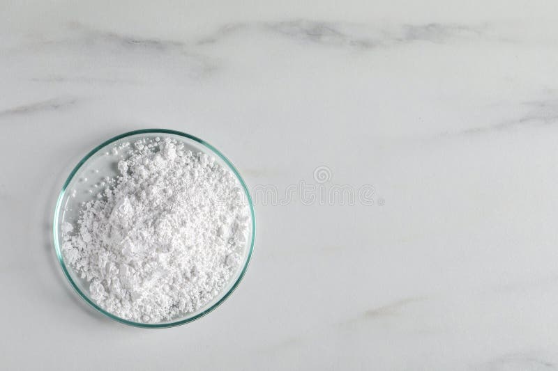 Petri Dish with Calcium Carbonate Powder on White Marble Table, Top