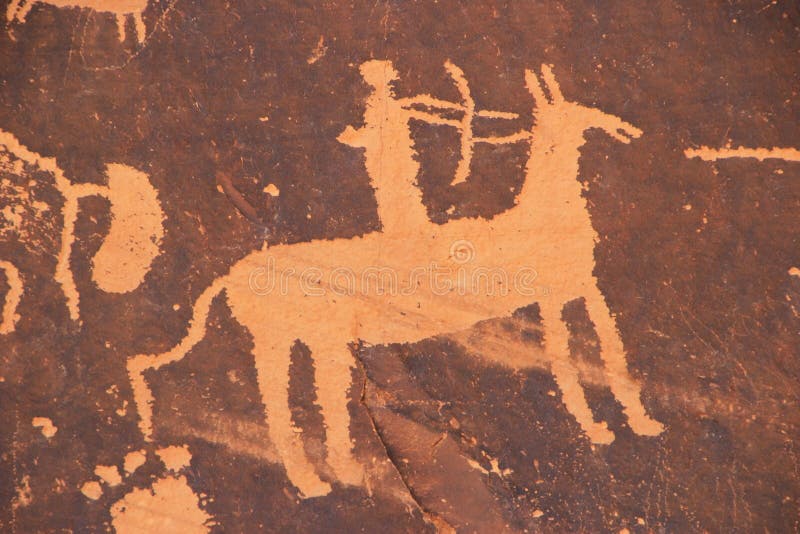 Petroglifi indiani, monumento storico dello stato della roccia del giornale, Utah, U.S.A. immagine stock libera da diritti Petroglifi indiani, monumento storico dello stato della roccia del giornale, Utah, U.S.A. immagine stock libera da diritti