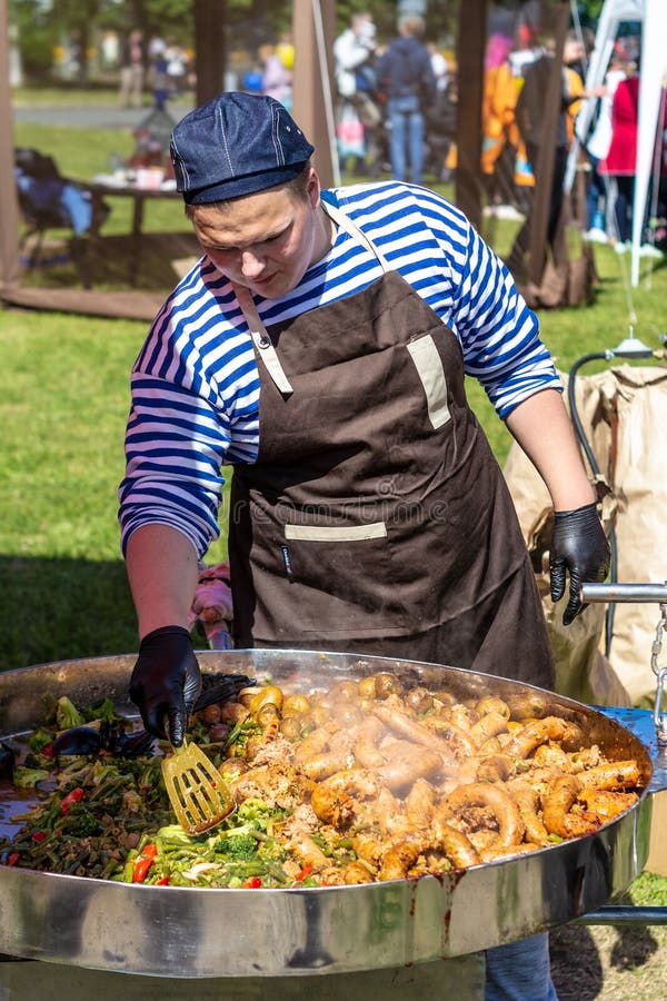 Chubby Cook Prepares Food in a Huge Street Grill Editorial Photography