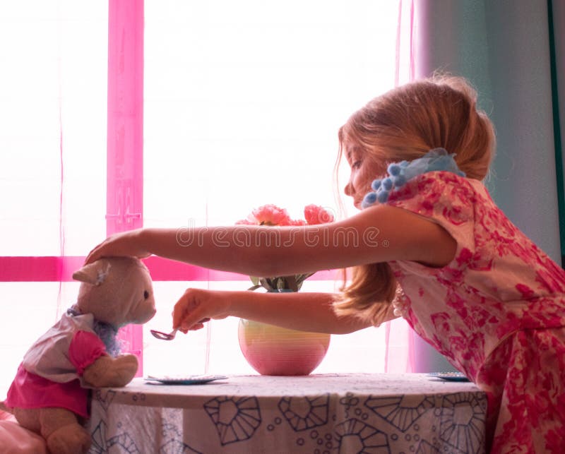 Petting and Feeding Little Lamb at Tea Party royalty free stock image Petting and Feeding Little Lamb at Tea Party royalty free stock image
