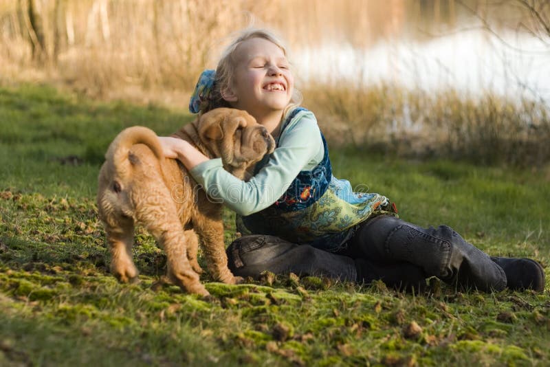 Petting my Sharpei puppy