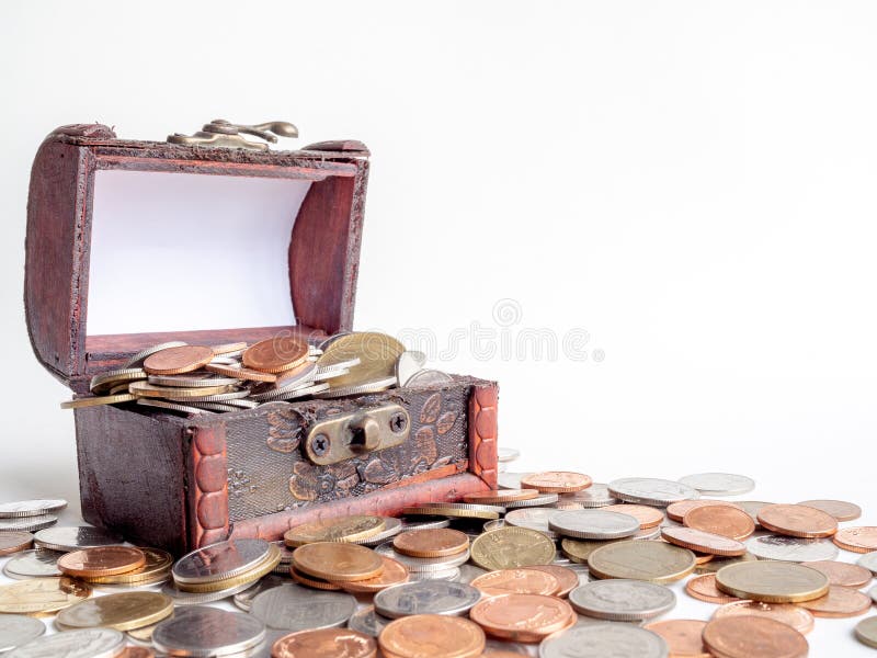 Money coins stack with treasure chest isolated on white background with copy space. Money coins stack with treasure chest isolated on white background with copy space.