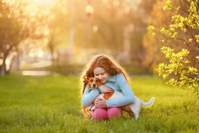 Little girl hugging her friend a dog in outdoors. Friendship, animal protection, lifestyle concept. Little girl hugging her friend a dog in outdoors. Friendship, animal protection, lifestyle concept