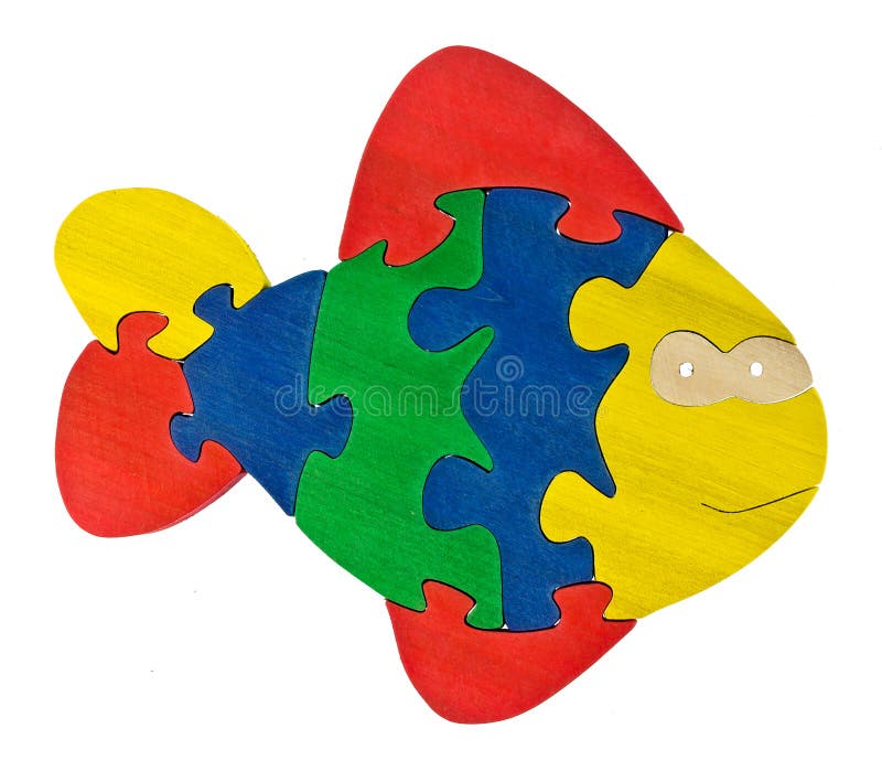 Pezzi di legno variopinti di puzzle nella forma del pesce immagini stock libere da diritti Pezzi di legno variopinti di puzzle nella forma del pesce immagini stock libere da diritti
