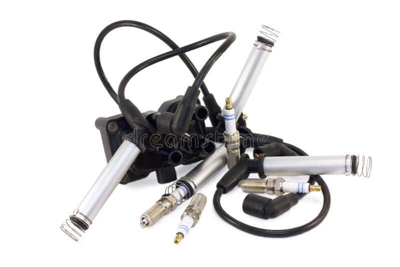 Auto parts. Candles and ignition coil for a car on a white background. Auto parts. Candles and ignition coil for a car on a white background