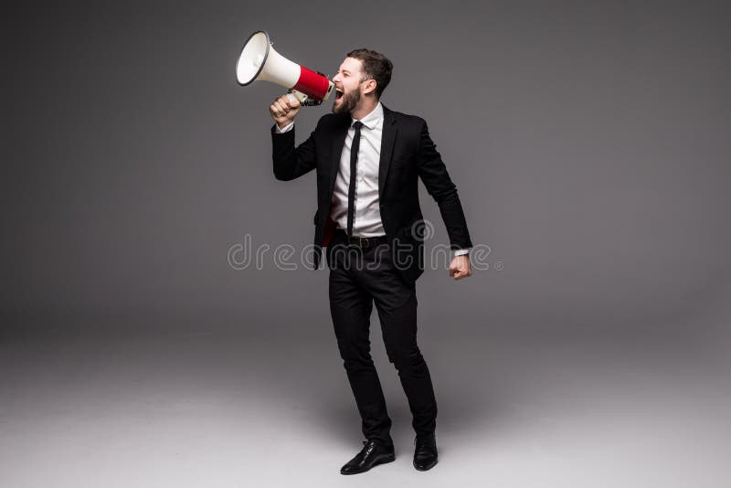 Pełnego wzrosta Biznesowy mężczyzna krzyczy z megafonem fotografia stock Pełnego wzrosta Biznesowy mężczyzna krzyczy z megafonem fotografia stock