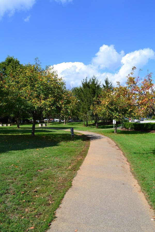 Path winds through park on a beautiful summer afternoon. Path winds through park on a beautiful summer afternoon