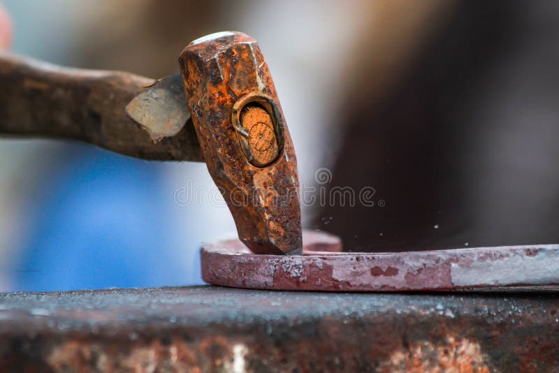 A shot of a horseshoe being crafted by a skilled blacksmith/farrier. Fantastic concept shot. The photo was taken using a 60D and edited in photoshop/lightroom. The picture was taken down in SouthWest England. Model release supplied where needed. A shot of a horseshoe being crafted by a skilled blacksmith/farrier. Fantastic concept shot. The photo was taken using a 60D and edited in photoshop/lightroom. The picture was taken down in SouthWest England. Model release supplied where needed.