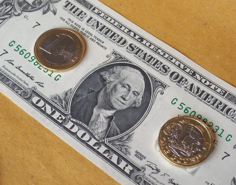 1 Pfund und 1 Euromünze und eine Dollarbanknote über Metallhintergrund stockbild 1 Pfund und 1 Euromünze und eine Dollarbanknote über Metallhintergrund stockbild