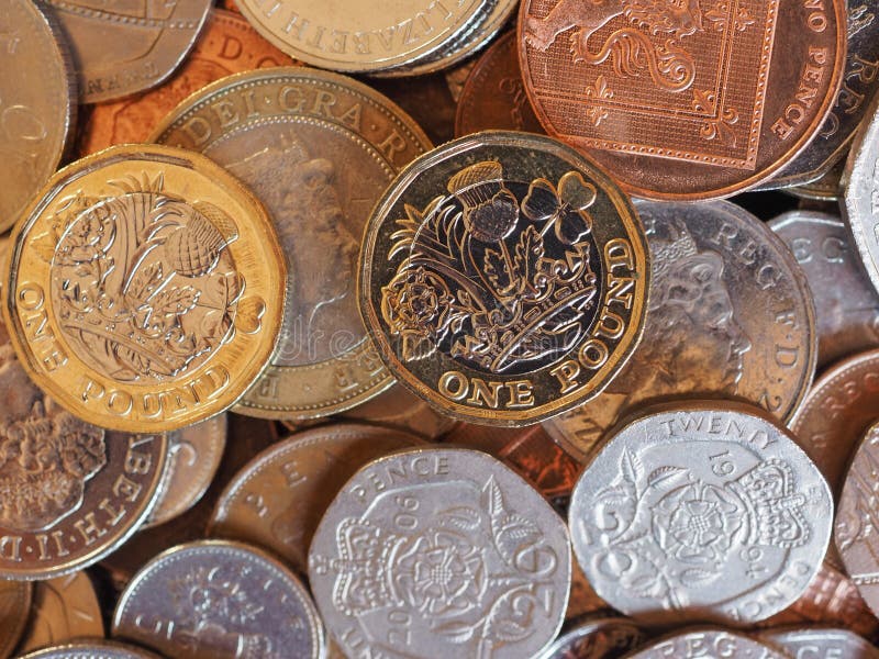 Pfundmünzen, Hintergrund Vereinigten Königreichs in London lizenzfreie stockfotos Pfundmünzen, Hintergrund Vereinigten Königreichs in London lizenzfreie stockfotos