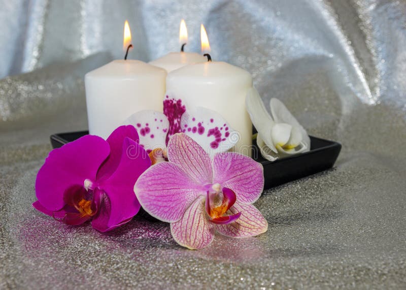 Phalaenopsis Flowers (orchid) and Burning Candles Stock Image - Image ...