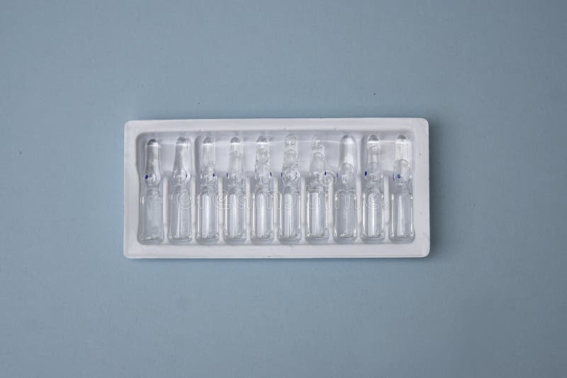 Pharmaceuticals ampoules with bright coloured backgrounds royalty free stock photography