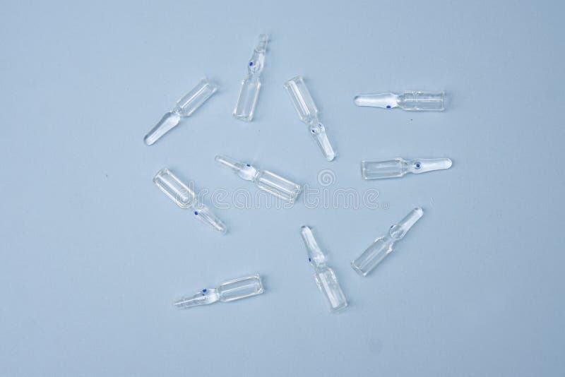 Pharmaceuticals ampoules with bright coloured backgrounds royalty free stock image