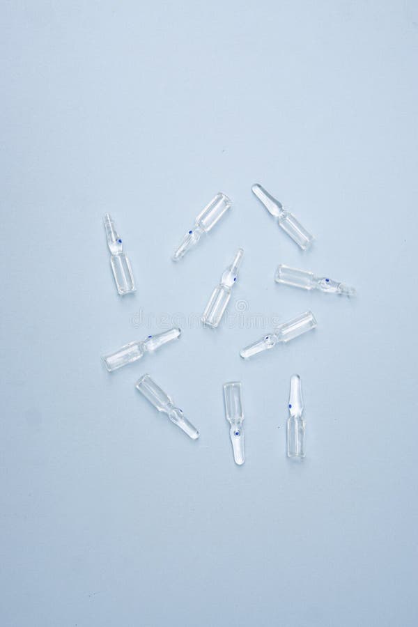 Pharmaceuticals ampoules with bright coloured backgrounds stock image