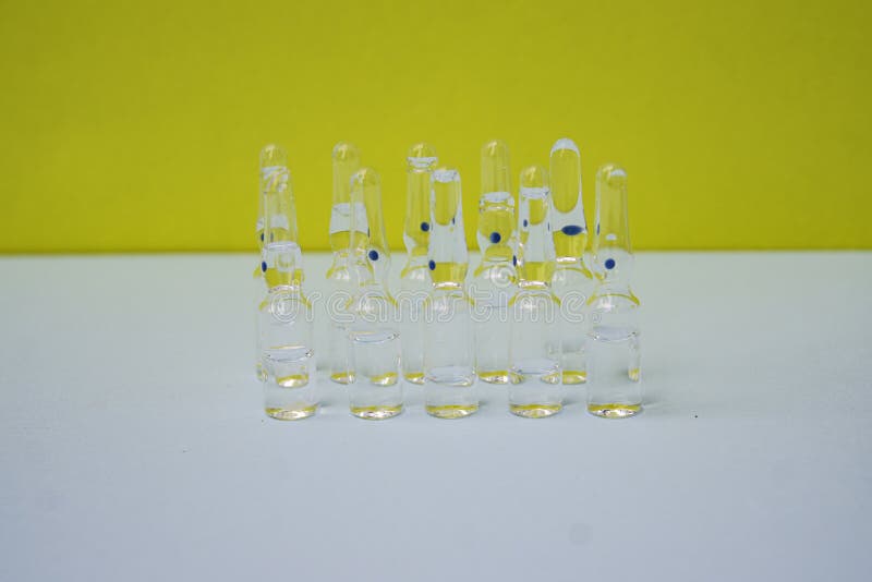 Pharmaceuticals ampoules with bright coloured backgrounds royalty free stock image