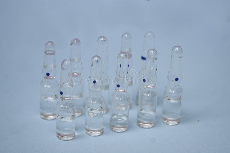 Pharmaceuticals ampoules with bright coloured backgrounds royalty free stock image