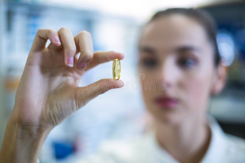 Pharmacist Checking a Capsule Stock Photo Image of pharmacist