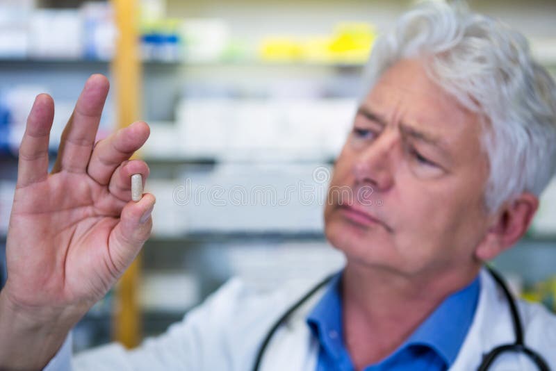 Pharmacist Checking a Capsule Stock Image Image of caucasian