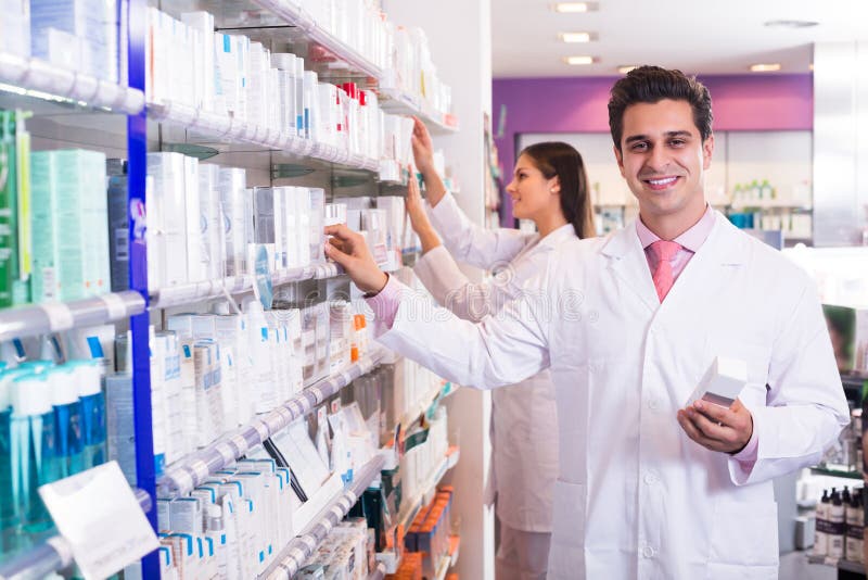 Pharmacist and Pharmacy Technician Posing Stock Photo - Image of people ...