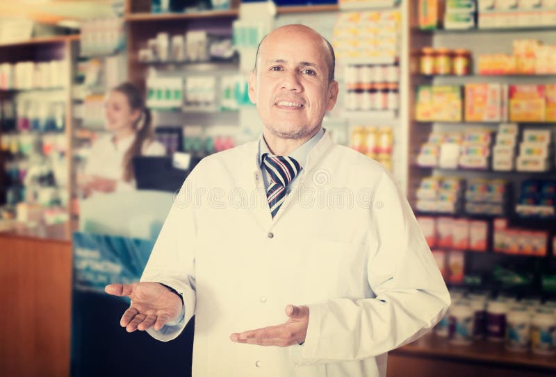 Pharmacist and Pharmacy Technician Posing in Modern Farmacy Stock Image