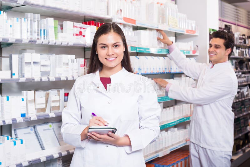 Pharmacist And Pharmacy Technician Posing Stock Image - Image of ...