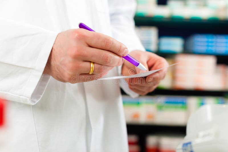 Pharmacist prescription slip in pharmacy stock photography Pharmacist prescription slip in pharmacy stock photography