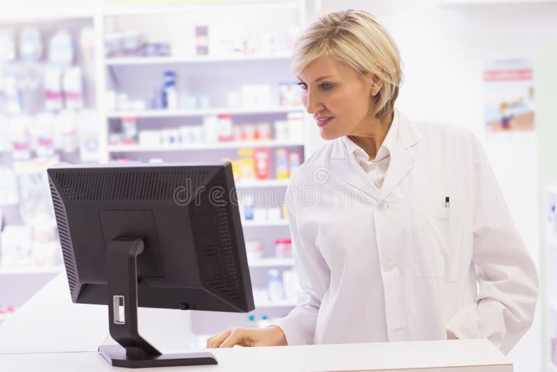 Pharmacist Using the Computer Stock Image Image of smiling