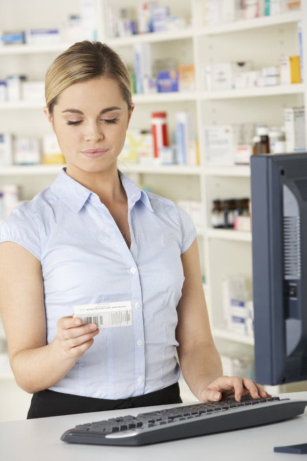 Pharmacist Working on Computer in Pharmacy Stock Photo Image of