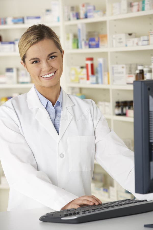 Pharmacist Working on Computer in Pharmacy Stock Image Image of