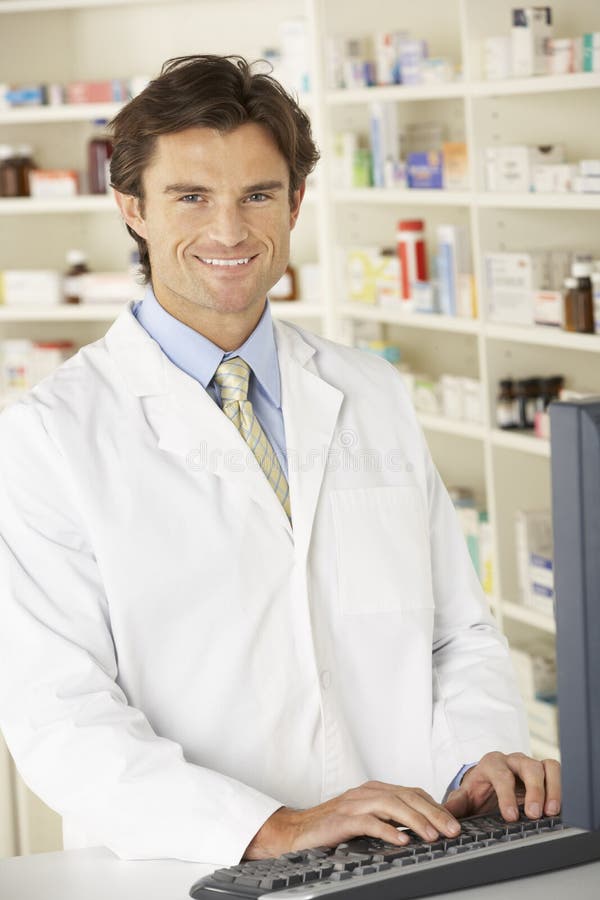 Pharmacist Working on Computer in Pharmacy Stock Photo Image of