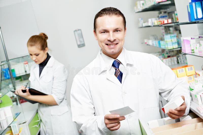 Pharmacy chemist man in drugstore stock image Pharmacy chemist man in drugstore stock image