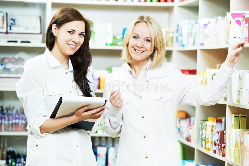 Pharmacy Chemist Women in Drugstore Stock Image - Image of confident ...