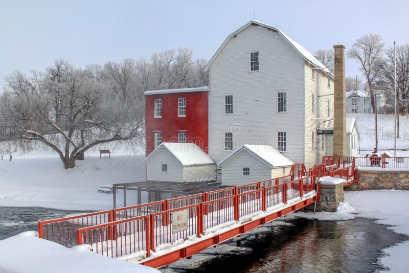 Phelp`s Mill in the winter. Old mill by a river