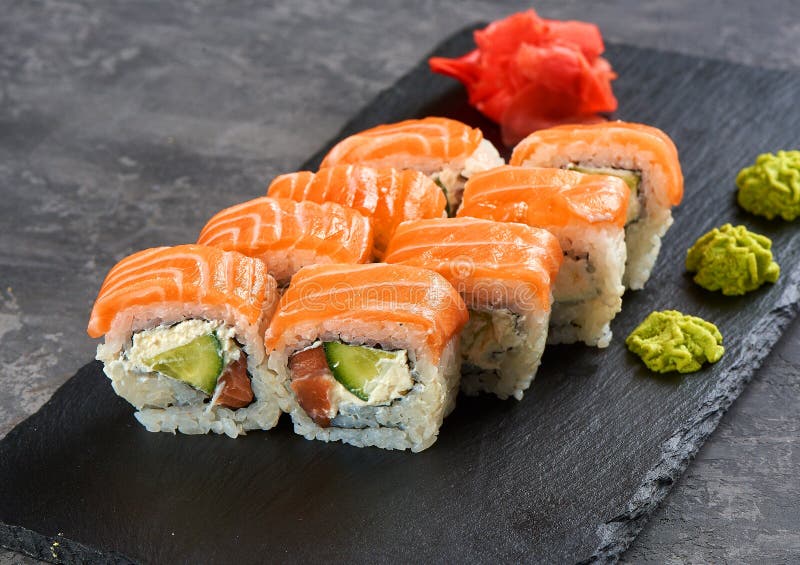 Philadelphia roll sushi with salmon, prawn, avocado, cream cheese. Sushi menu. Japanese food.