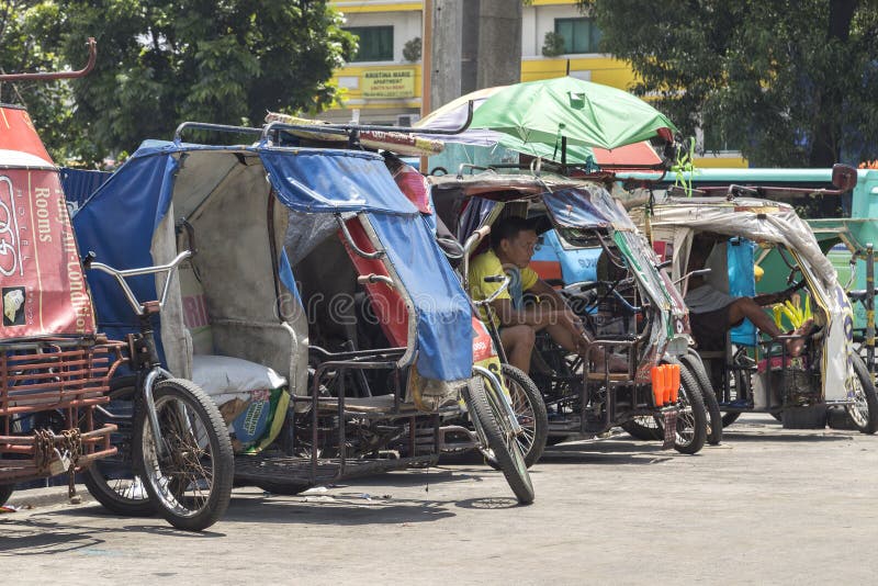 Philippine tricycles on the street stock photos Philippine tricycles on the street stock photos