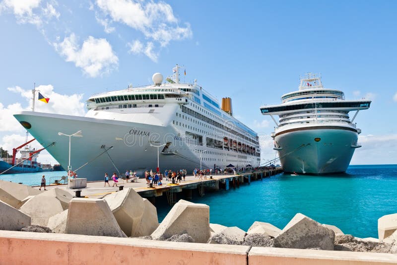 Philipsburg, St. Maarten - Jan. 16, 2013: Cruise ships docked at Dr. A. C. Wathey Pier on the Dutch side of St. Maarten. Passengers wanting to go to town are tendered to the smaller Captain Hodge Pier in Philipsburg.