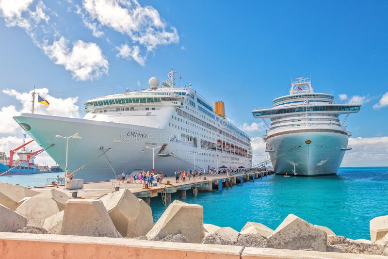 Philipsburg, St. Maarten - Jan. 16, 2013: Cruise ships docked at Dr. A. C. Wathey Pier on the Dutch side of St. Maarten. Passengers wanting to go to town are tendered to the smaller Captain Hodge Pier in Philipsburg.