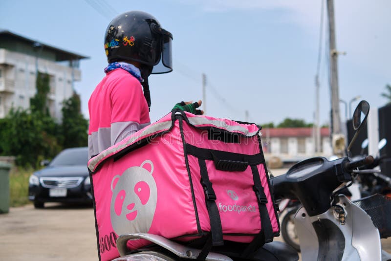 Phitsanulok, Thailand - May 24, 2020: Food order online via Foodpanda being delivered, Food panda rider deliver food at the front door of a residence, Foodpanda is a mobile food delivery marketplace