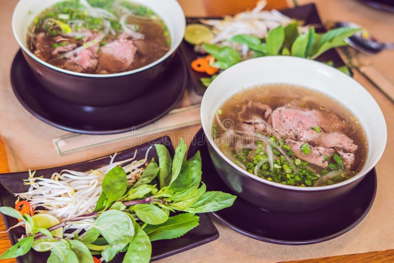 Pho Bo - Vietnamese fresh rice noodle soup with beef, herbs and chili. Vietnam`s national dish