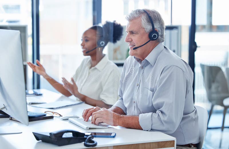 Phone call, customer service and mature man with headset, computer and callcenter agent in crm office. Tech support royalty free stock photos