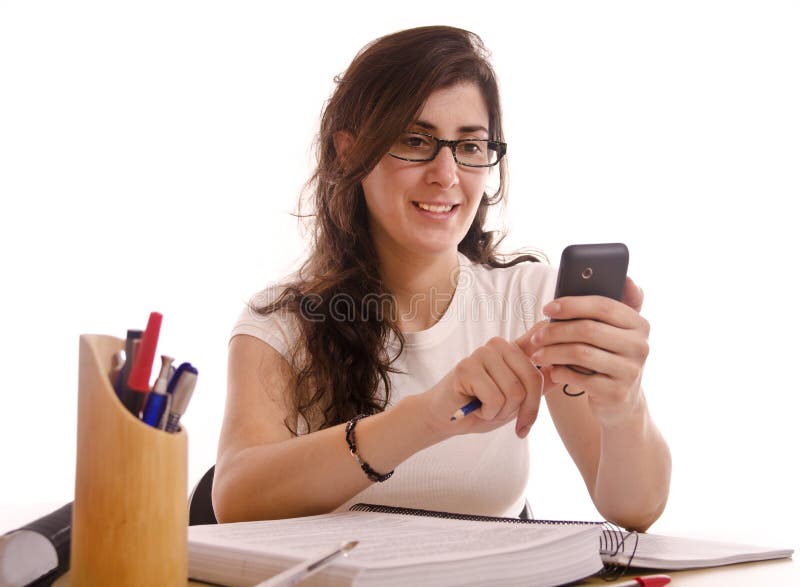 Student adult woman stop her study time for send a phone sms. Student adult woman stop her study time for send a phone sms.