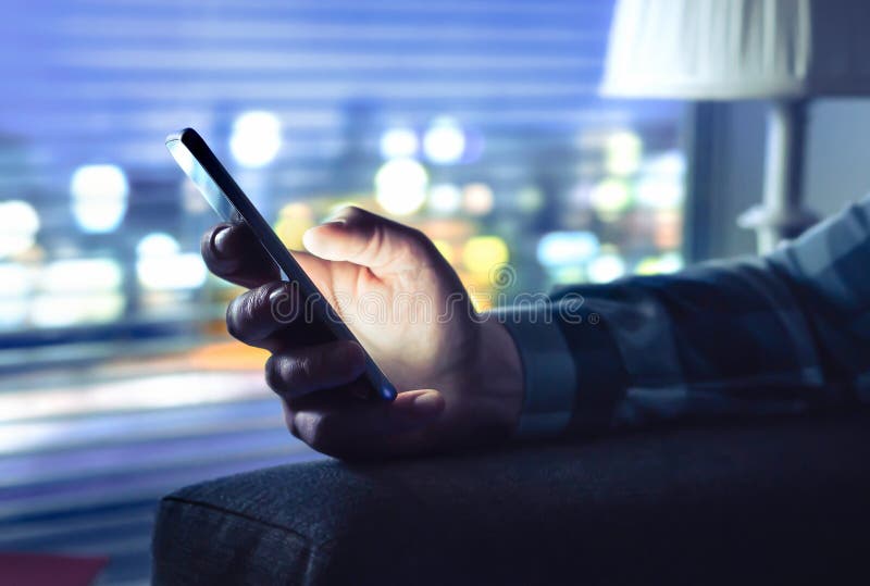 Phone with fraud text message, unknown scam call or night texting. Man using smartphone. Anonymous caller or sms scammer. royalty free stock image